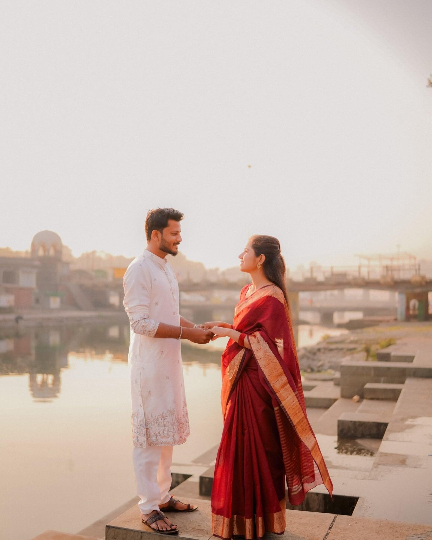 Couple at sunrise on the Nashik ghats during their pre-wedding shoot